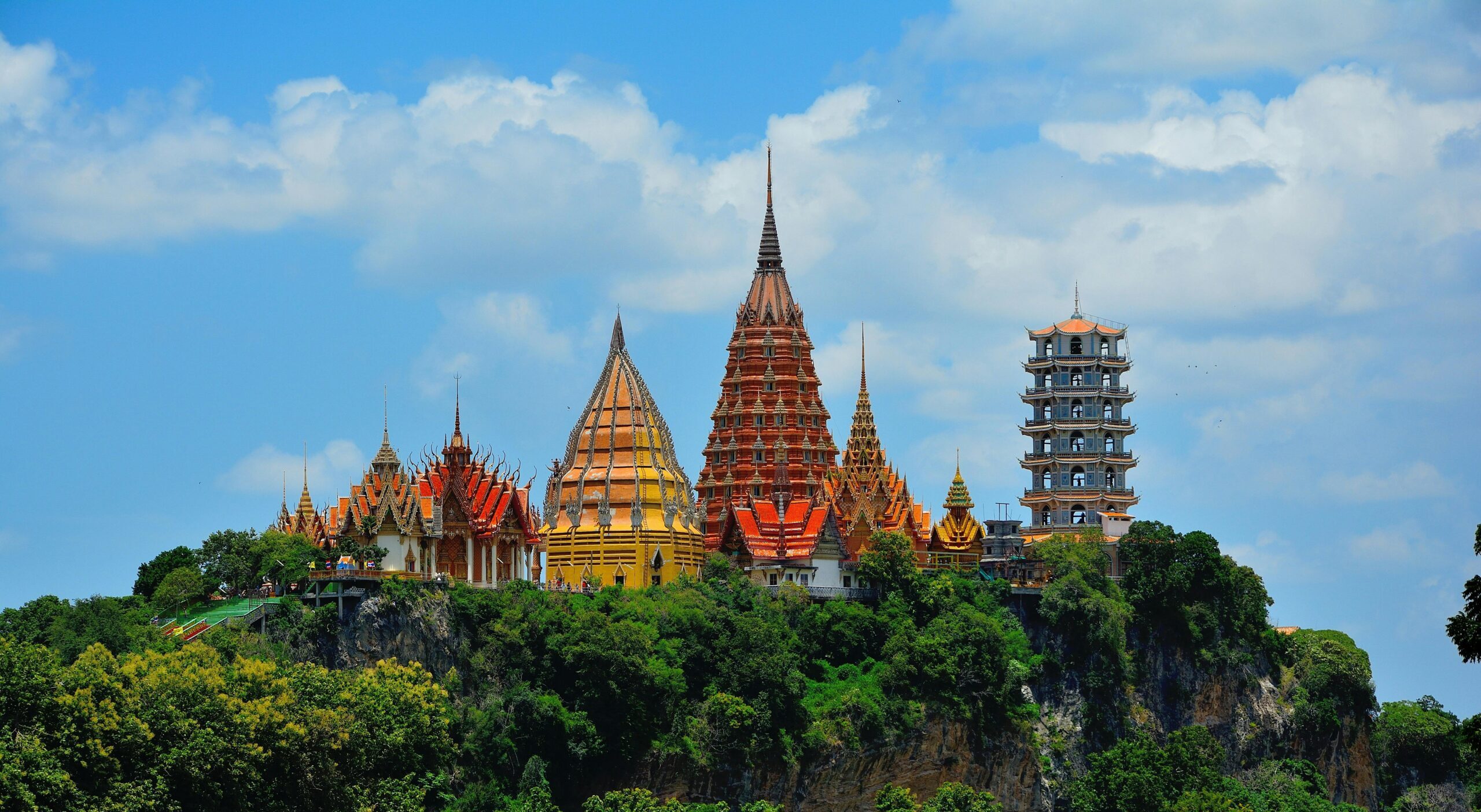 Stunning view of Wat Tham Suea temple in Thailand surrounded by lush greenery.